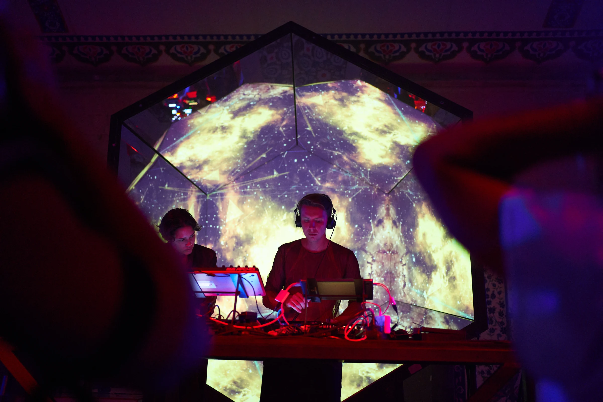DJs surrounded by the projected colours of Gateway in the ABOUT YOU campaign