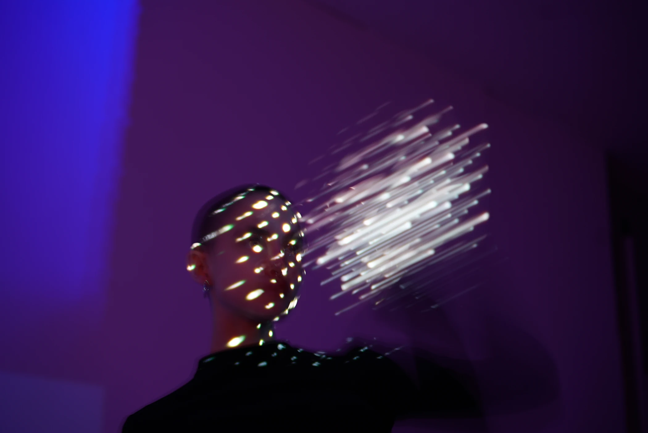 Touch, 2020 — points of white light extend beyond a figure into violet space