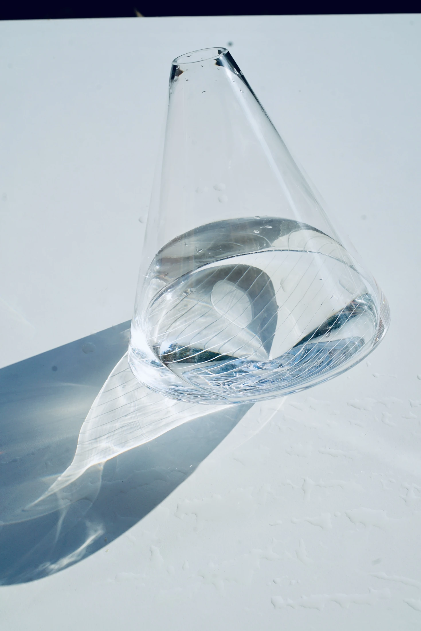 The jug and its shadow on a sunlit table