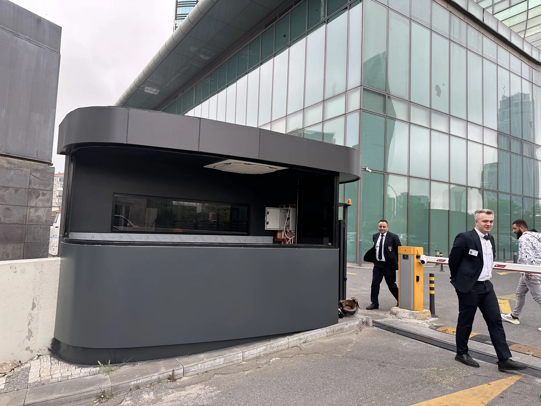 The completed security cabin beneath the glass facade