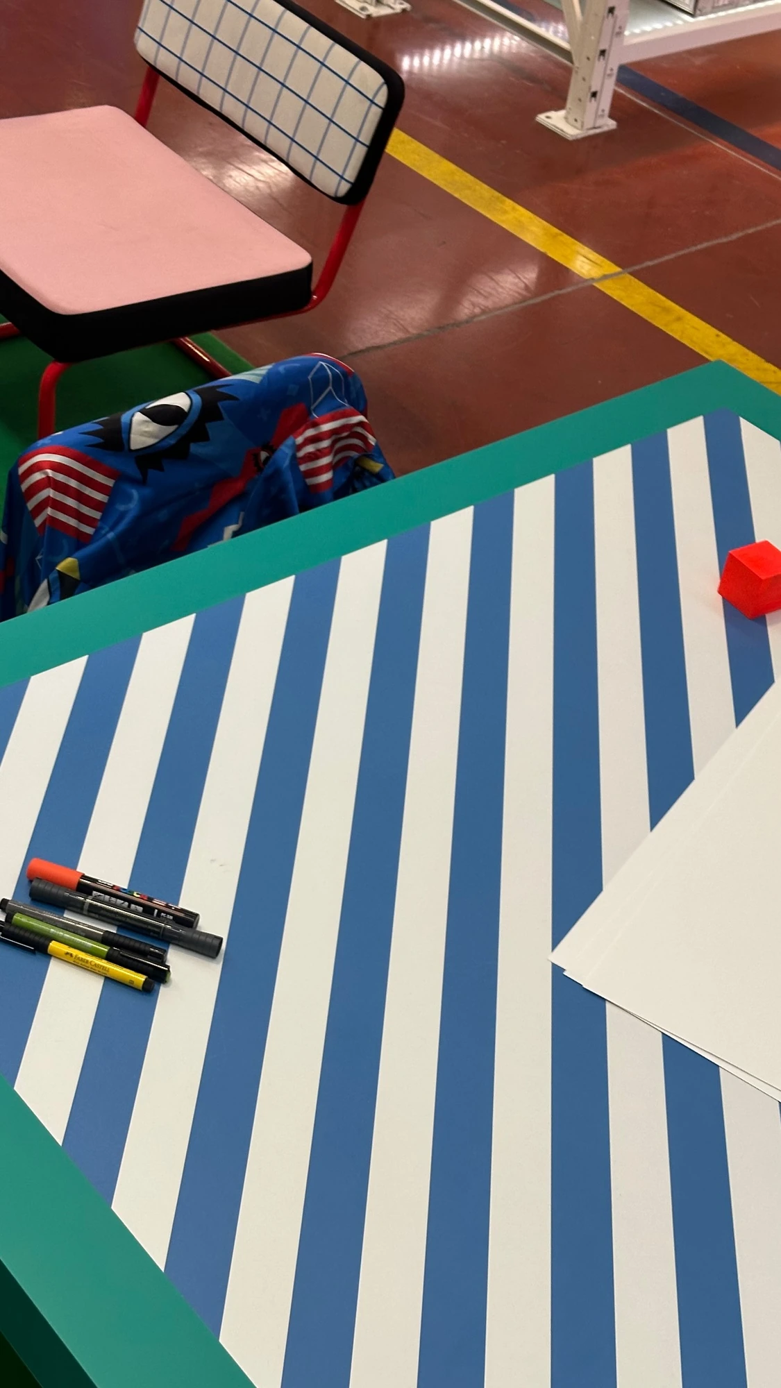 Drawing and working materials at the workshop table