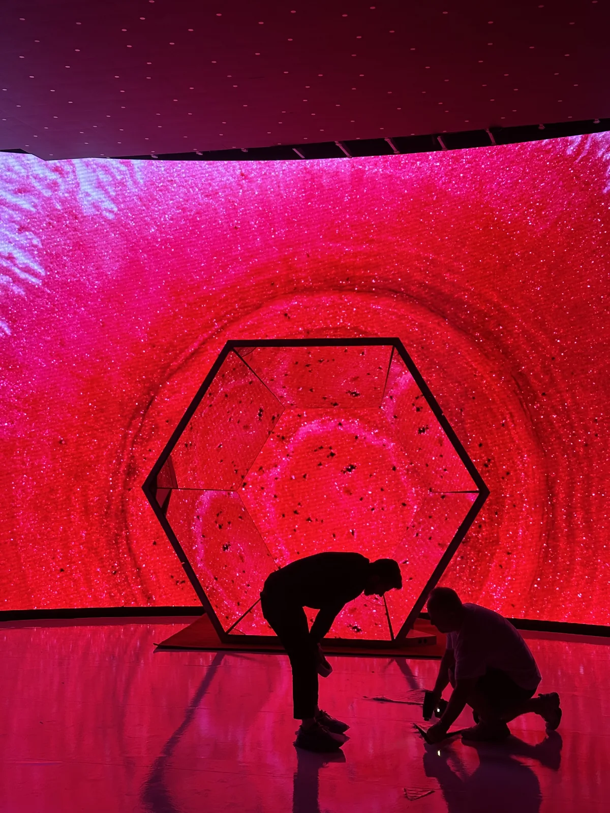 Preparing Space on the red-lit Vichy set